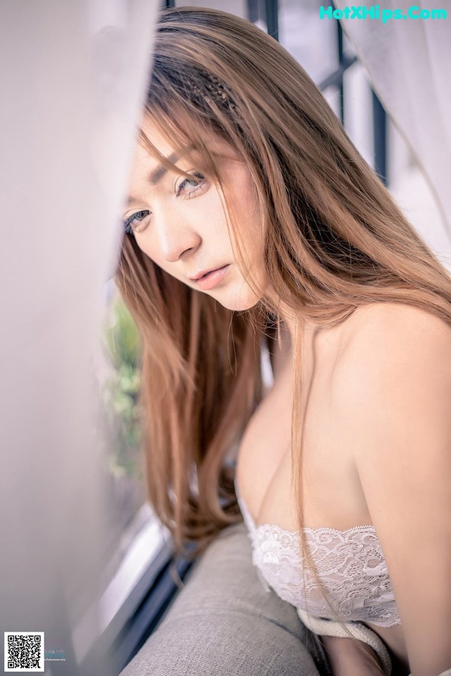 Beautiful Napasorn Sudsai poses super hot with white lingerie (16 photos)